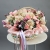 Композиция в корзине "Диодора" из французских роз Квиксенд, диантусов и кустовых пионовидных роз Бомбастик в Истре